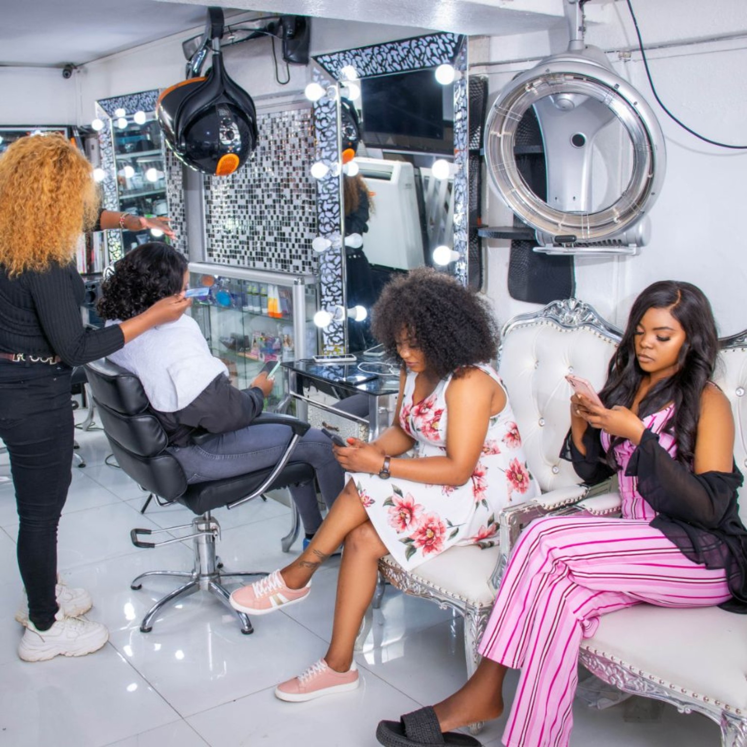 Interior of Joy Barber & Salon with styling chairs and mirrors